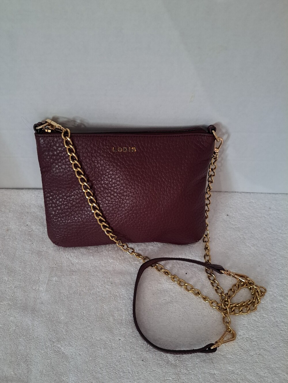 Lodis Pebbled Leather Crossbody Bag in Wine with Gold Chain